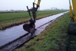 Baggeren achter het doek.